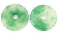 Lot 437 - Pair of green jade discs.
