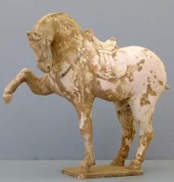 Lot 498 - Tang white prancing horse with saddle.