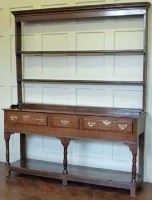 Lot 771 - Oak three drawer dresser with plate rack.