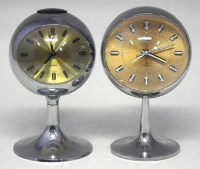 Lot 830 - Two 1960's pedestal ball clocks (2).