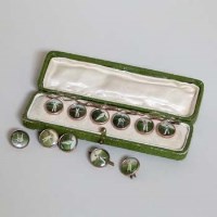 Lot 16 - Cased set of gold plated cricket shirt buttons and five others.