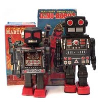 Lot 83 - Battery operated Dino Robot and an attacking Martian, both boxed.