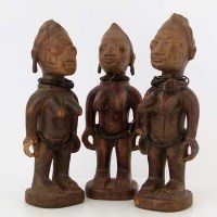 Lot 142 - Egbado Yoruba female triplets group of figures