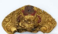 Lot 167 - Tibetan gilt copper temple door plate, 18th
