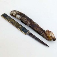 Lot 218 - Chinese brown jade buckle and a small Japanese