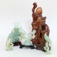 Lot 229 - Three Jade birds, a Jade vase and two carved wood immortals.