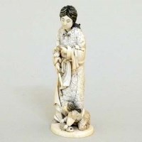 Lot 304 - Ivory figure of a lady and child.