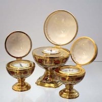 Lot 356 - Royal Crown Derby boxed globe clock, thermometer and barometer.
