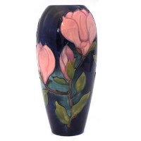 Lot 377 - Moorcroft Magnolia pattern vase (blue) boxed