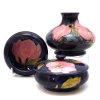 Lot 391 - Moorcroft Magnolia pattern box, vase and dish