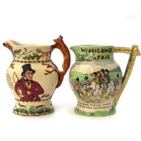 Lot 394 - Two Crown Devon musical jugs