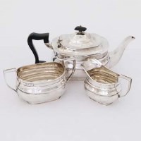 Lot 512 - Silver three piece tea set.