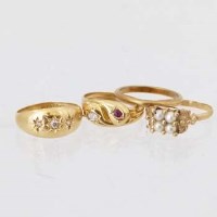 Lot 581 - 18ct gold gypsy three-stone ring and three other rings.