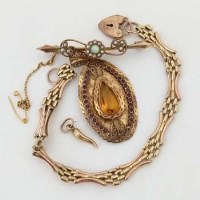 Lot 588 - Indian gold oval pendant of a yellow citrine and