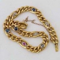 Lot 610 - Gold chain bracelet set coloured stones.