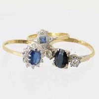 Lot 612 - Three 18ct gold sapphire and diamond rings.