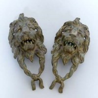 Lot 970 - Pair of brass lions heads.