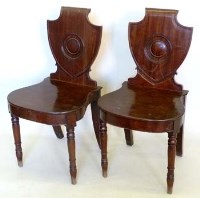 Lot 1025 - Pair George III mahogany hall chairs