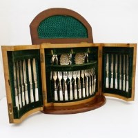 Lot 177 - An Edwardian dessert set, 12 knives and forks etc. in walnut presentation box.