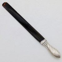 Lot 221 - Silver handled tortoiseshell paper knife.