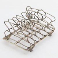 Lot 228 - Silver toast rack.