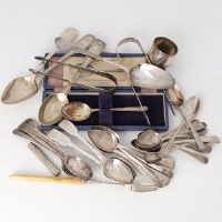 Lot 254 - Collection of silver spoons, sugar nips etc.