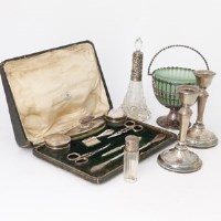 Lot 255 - Silver sugar bowl, two scent bottles, pair of candlesticks and a manicure set.