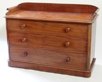 Lot 532 - Mid Victorian mahogany chest of three long drawers