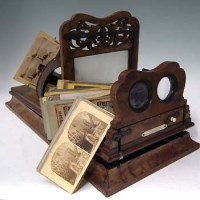 Lot 29 - Walnut Negretti and Zambra stereoscopic slide complete with quantity slides and portable ditto.