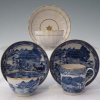 Lot 174 - 18th Century New Hall coffee cup and saucer with the 'Trench Mortar' pattern, a 'Trench Mortar' tea bowl and saucer and a New Hall white and gilt face