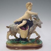 Lot 186 - Majolica goat and cherub group.