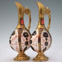 Lot 209 - Pair of Crown Derby ewers.