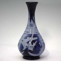 Lot 235 - Moorcroft blue lagoon vase.