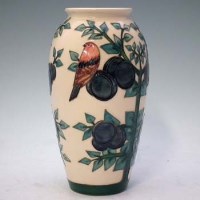 Lot 239 - Moorcroft plum vase large.