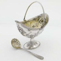 Lot 261 - Victorian silver sugar basket and sugar sifter.