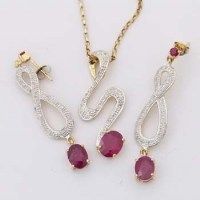 Lot 380 - Ruby and diamond snake pendant on chain and a