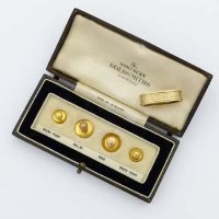 Lot 382 - Cased set of four gold shirt studs, 9ct gold scarf clip.