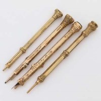 Lot 393 - 9ct gold pencil and three other yellow metal pencils.