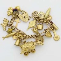 Lot 397 - Gold charm bracelet.