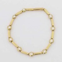 Lot 410 - 18ct gold line bracelet of elongated links set