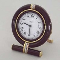 Lot 6 - Cartier (Paris) alarm clock and spare batteries.