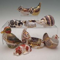 Lot 174 - Nine Royal Crown Derby paperweights.