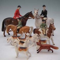 Lot 187 - Beswick hunt set including huntsman, huntswoman, girl on pony, boy on pony, six hounds and a fox.