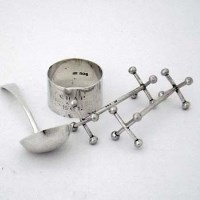 Lot 214 - Pair of silver knife rests; napkin ring; small