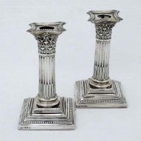 Lot 216 - Pair filled silver Corinthian candlesticks