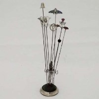 Lot 222 - Collection of nine hat pins and a Silver hat pin