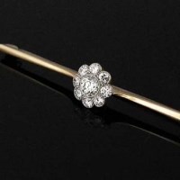 Lot 285 - Millegrain Diamond and Gold Bar Brooch