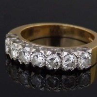 Lot 312 - Seven-stone diamond hoop ring.