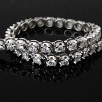 Lot 335 - 18ct white gold line bracelet, approximately