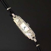 Lot 370 - Platinum and diamond lady's dress watch.